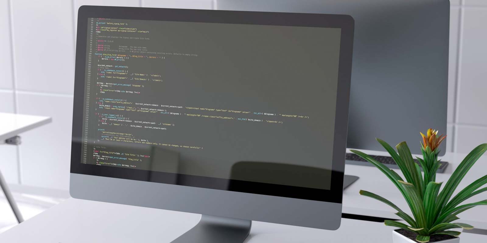 Ecran d'ordinateur avec code pendant la création de site web en Loire Atlantique